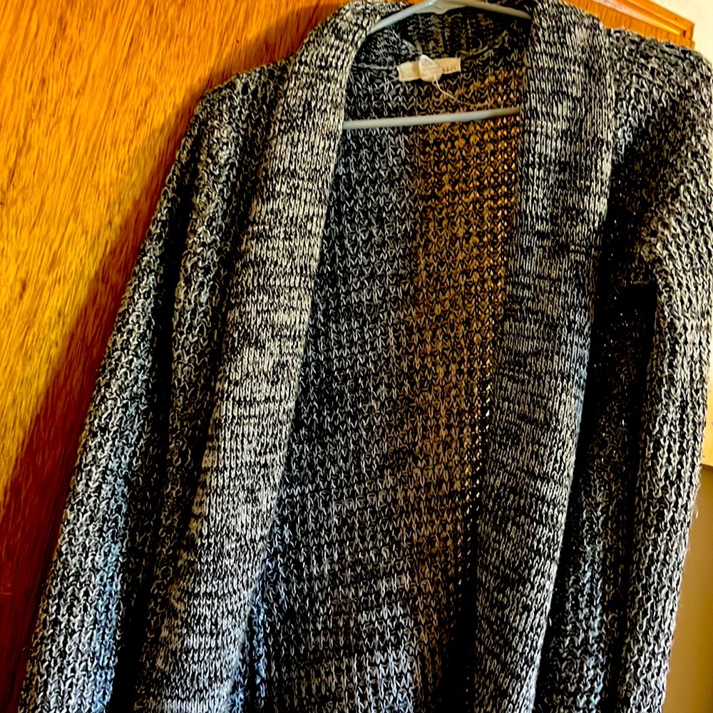 Woman’s black and white long, chunky cardigan